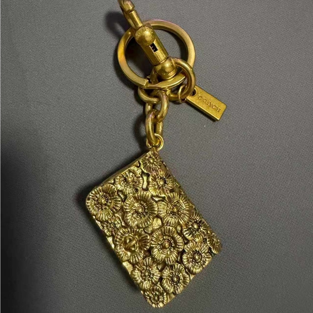 Coach Gold Floral Embossed Keychain Charm